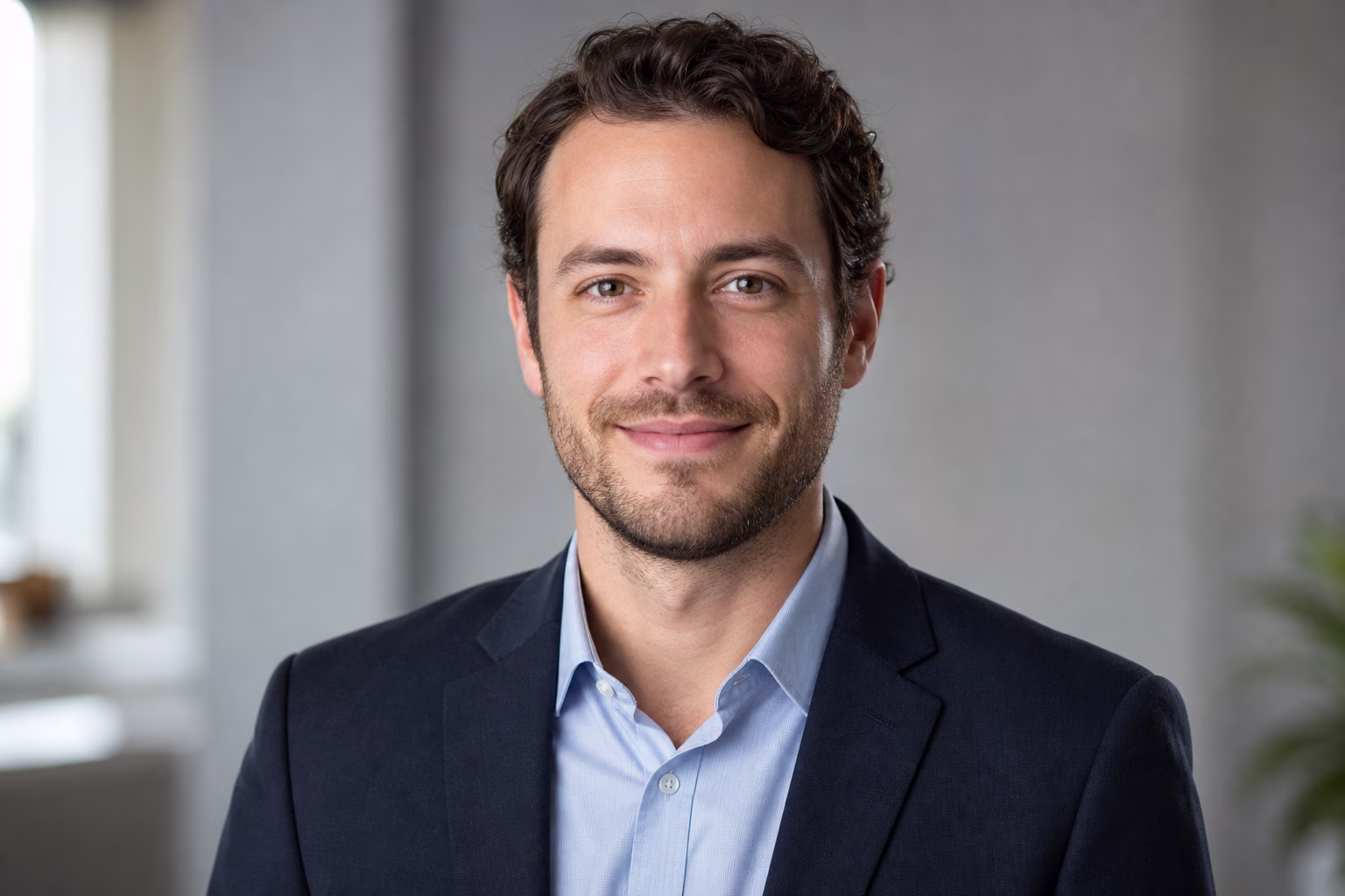 Generated professional headshot with neutral background and business clothing